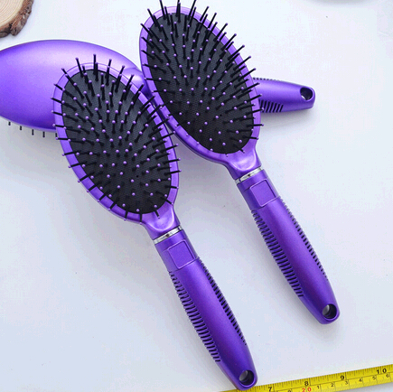 Wholesale purple color plastic head massage comb