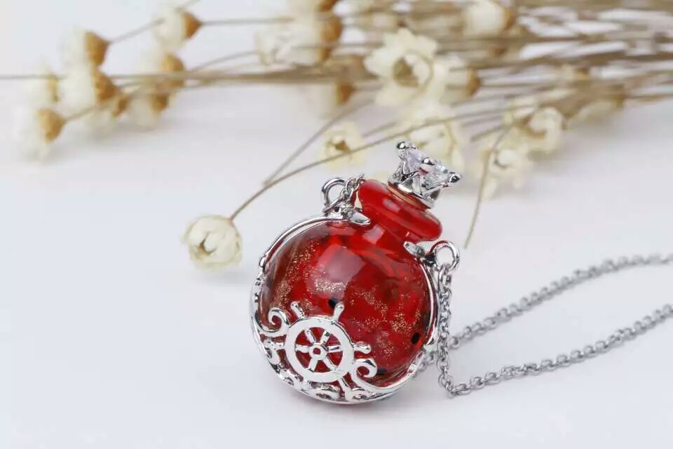 Wholesale human skeleton shape metal alloy box essencial oil red color bottle necklace with crown lid