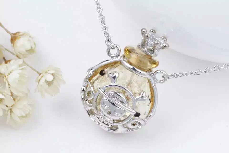 Wholesale human skeleton shape metal alloy box essencial oil yellow color bottle necklace with crown lid