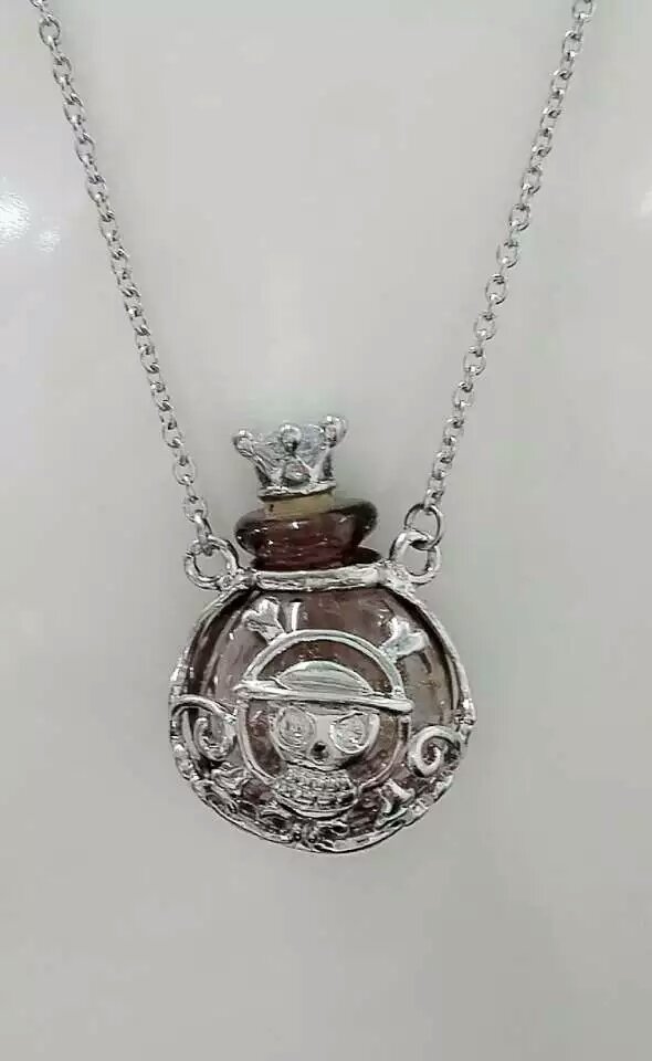 Wholesale human skeleton shape metal alloy box essencial oil purple color bottle necklace with crown lid