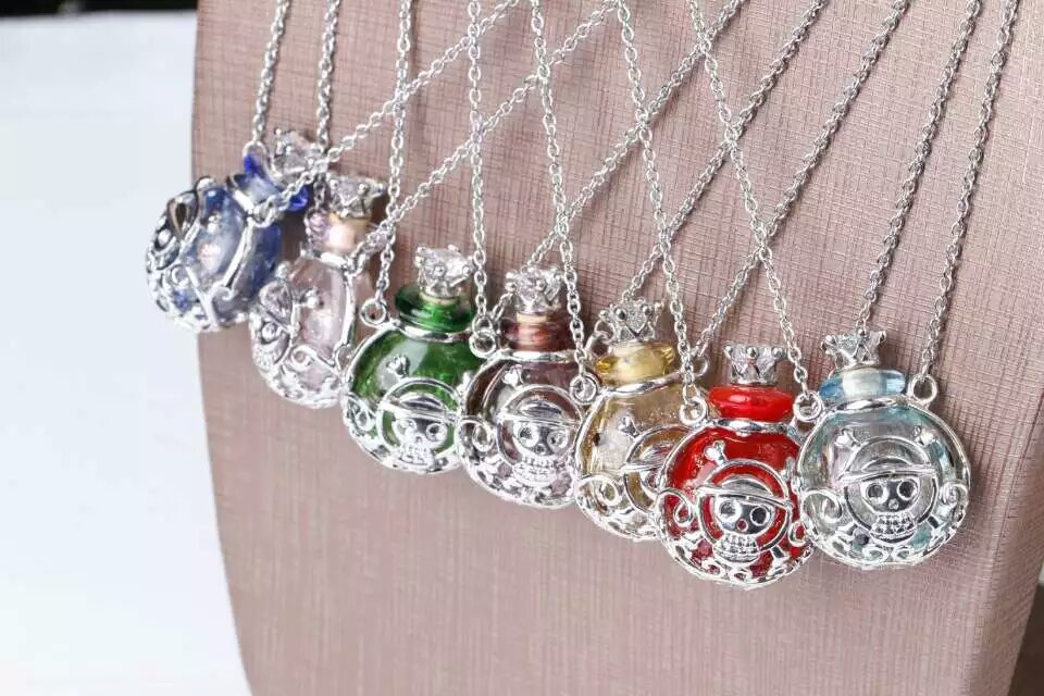 Wholesale human skeleton shape metal alloy box essencial oil bottle necklace with crown lid